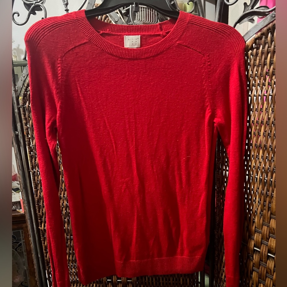 Red long sleeve sweater. Size XS. No tears